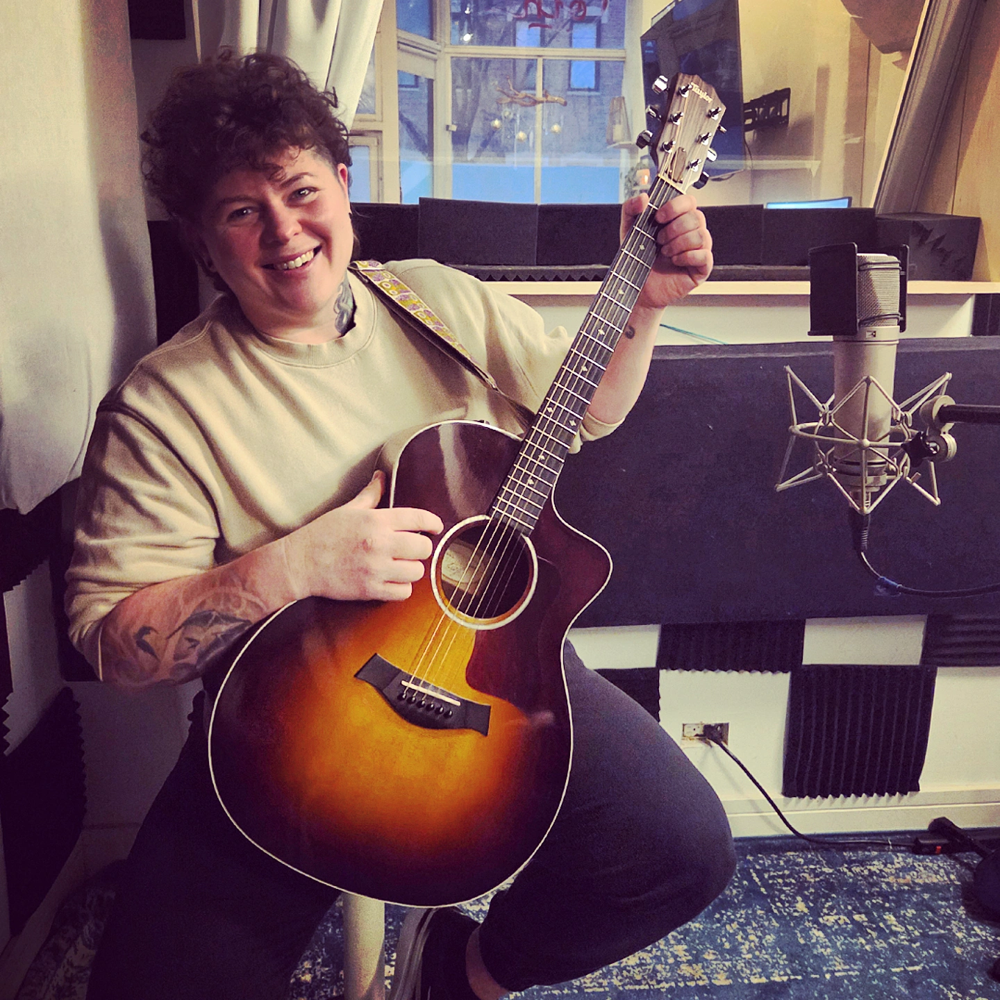 Folk Artist Playing Guitar In Chicago Music Studio