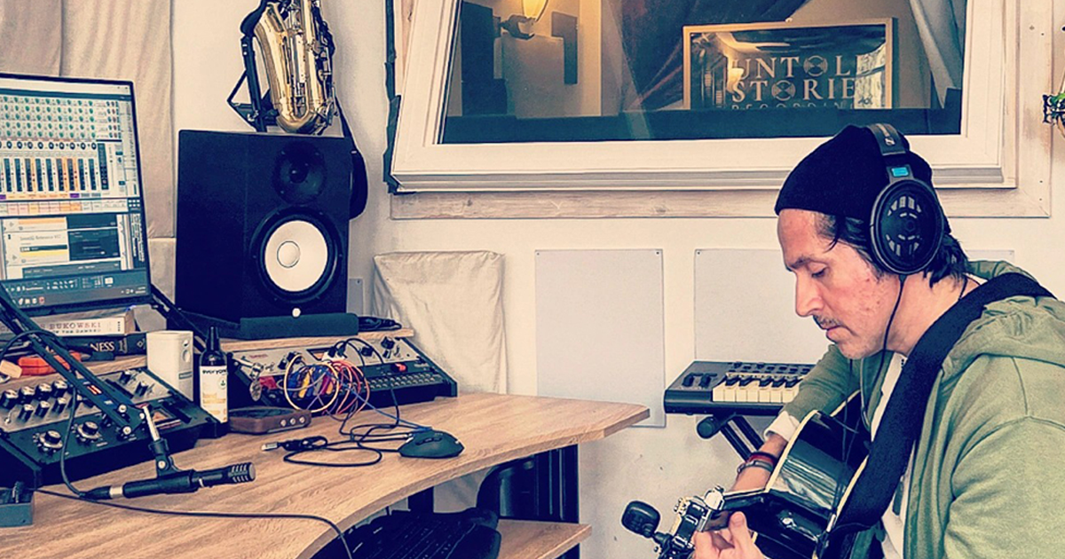 Guitar Player Outside Booth In Chicago Music Studio