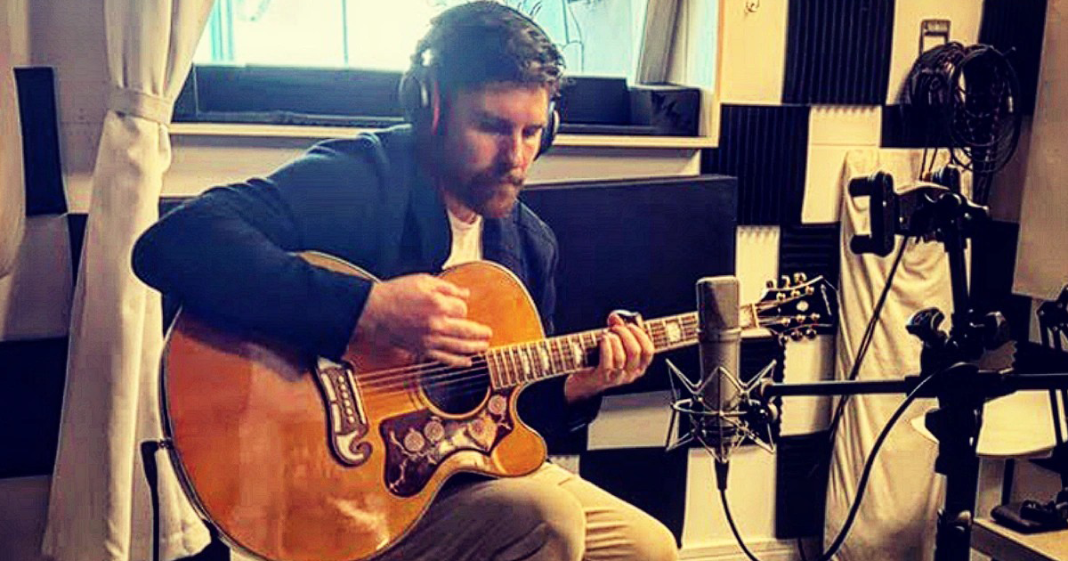 Man Playing Acoustic Guitar With U87 Mic In Chicago Music Studio