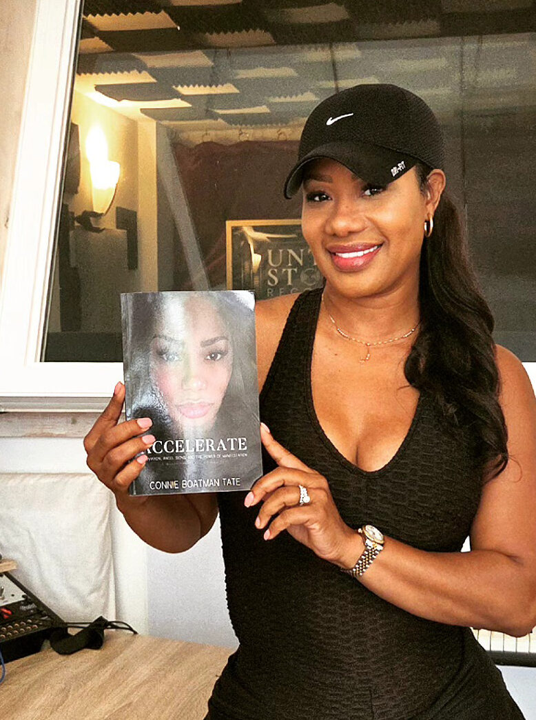Woman Holding Audiobook She Recorded In Chicago Recording Studio